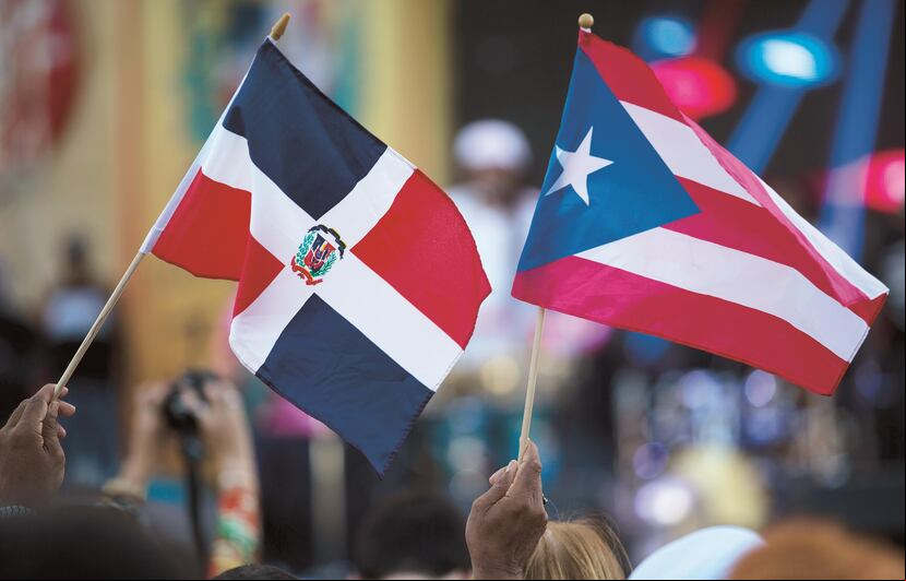 La mayoría de los inmigrantes en Puerto Rico proviene de la vecina República Dominicana. En la foto, las banderas de ambos países. (GFR Media)